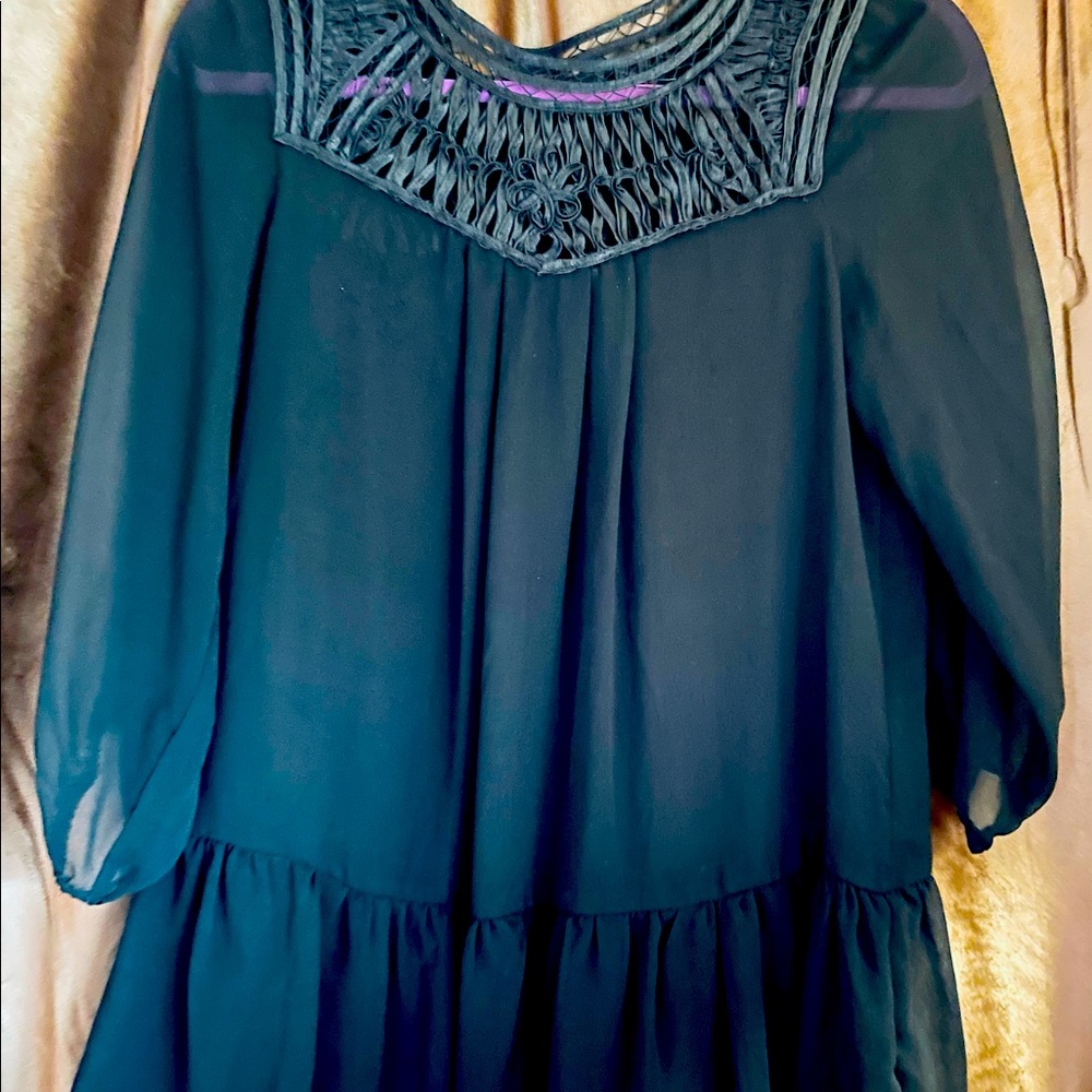 Sheer dressy black blouse.